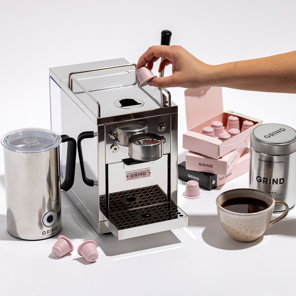 Coffee machine grind outlet
